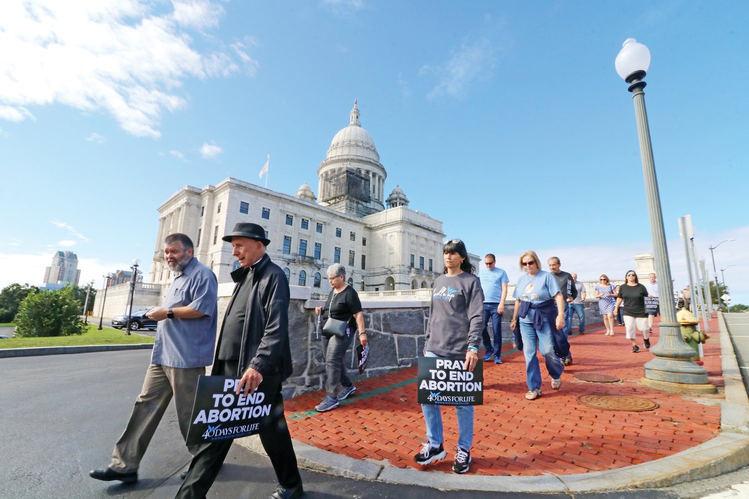 Barth Bracy, the executive director of the Rhode Island Right to Life Committee and Father John Kiley lead the way during the Jericho Walk around the Statehouse on Saturday, Sept. 25.